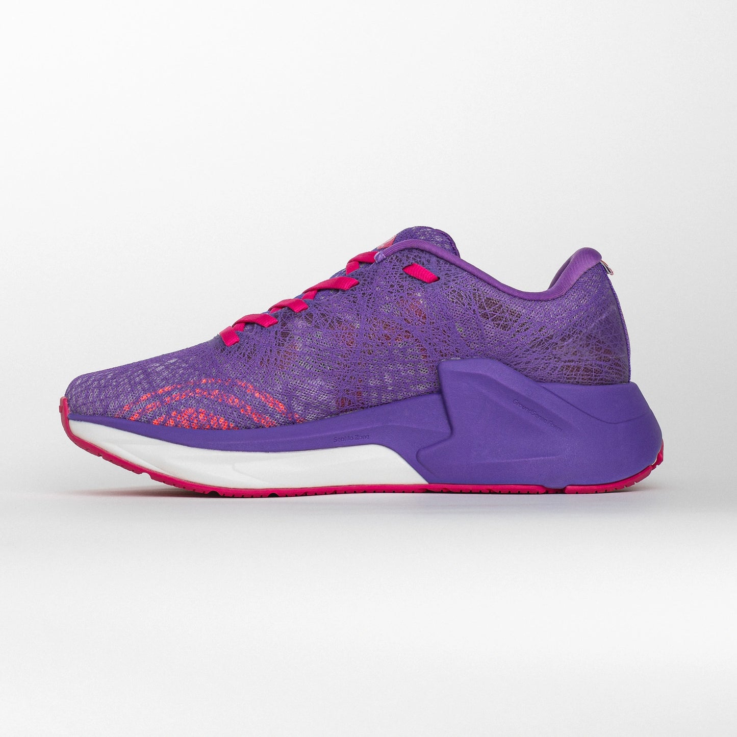 Inner side view of a pink and purple MOVV running shoe with a streamlined design, cushioned purple midsole, and reinforced heel structure for stability.