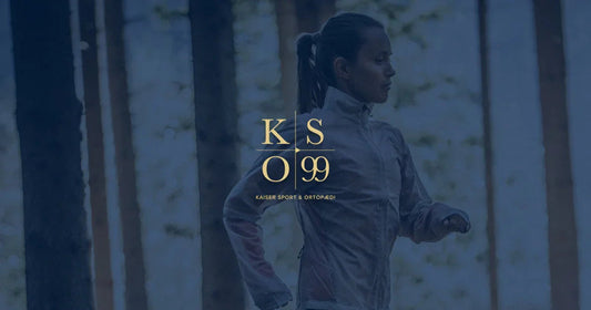 Minimalistic white and grey running shoe designed for injury reduction, displayed on a transparent background